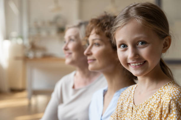 istock Happy three female generations family posing at home. 1330084384