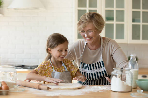 istock Happy family having fun cooking in kitchen. 1330084435