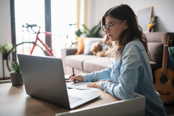 istock Concentrated woman is working at home. 1330086012
