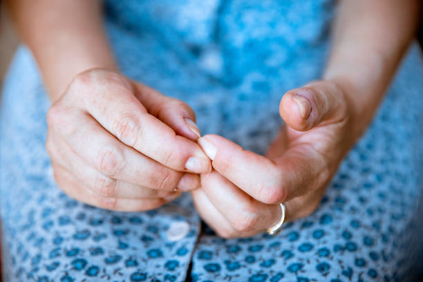 Woman icking her nails Hands of abused Woman in her lap, closeup. Nervious Female in stress interrogation woman stock pictures, royalty-free photos & images