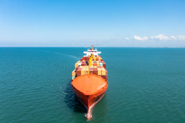 istock Aerial view of cargo ship approaching to the port 1330088384