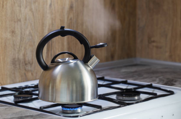 istock metal silver modern kettle on   gas stove in kitchen 1330092160