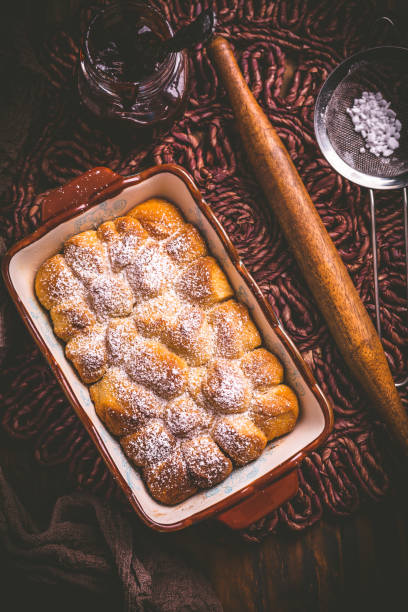 istock Buchteln filled with plum jam or jelly, sweet rolls with backing ingredients 1330095905