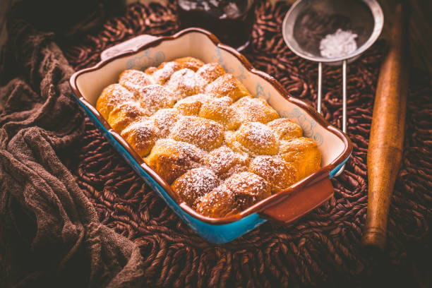 istock Buchteln filled with plum jam or jelly, sweet rolls with backing ingredients 1330095948