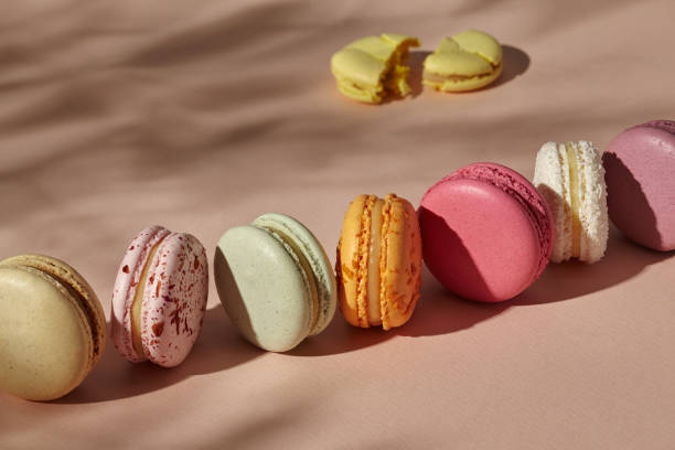 istock Whole macarons arranged in line and one broken cookie 1330098139
