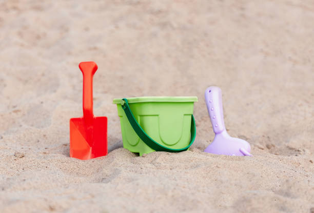 istock Beach kid's toys on white sand beach 1330100394