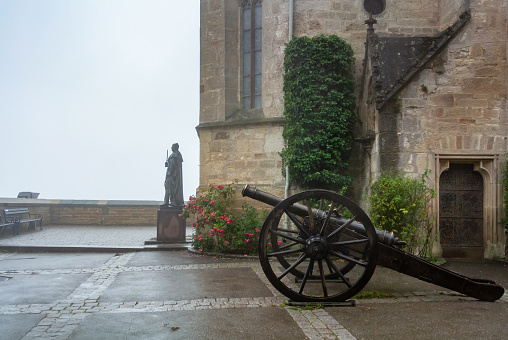 Antique Cannon at Hohenzollern Castle in fog, Baden-Wurttemberg, Germany.