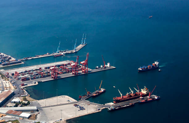 istock Aerial  view of cargo vessel is loading containers 1330104255