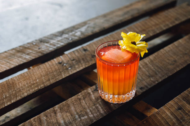 istock tropical cocktail with yellow flower 1330109101