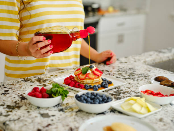 Woman Cooking Pancake Breakfast in a Home Kitchen