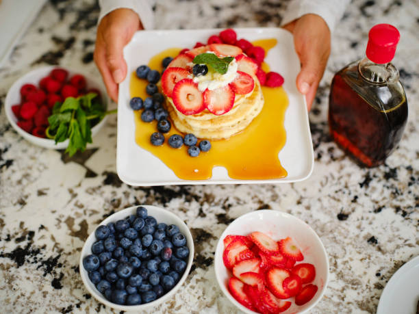 istock Woman Cooking Pancake Breakfast in a Home Kitchen 1330109148