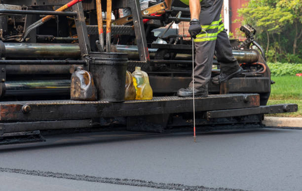 istock resurfacing residential road with asphalt paving machine 1330114132