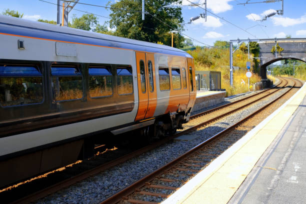 istock Generic Electrified railway line station in the English countryside. 1330114154
