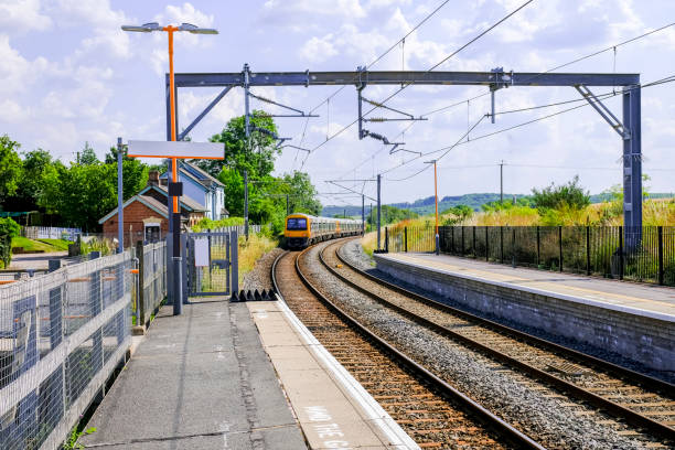 istock Generic Electrified railway line station in the English countryside. 1330114172