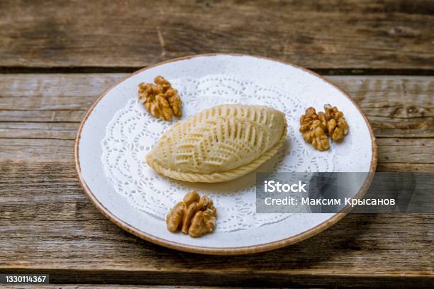 Sekerbura With Walnuts On White Plate On Old Wooden Table Stock Photo - Download Image Now