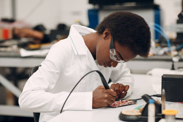 istock Scientist african american woman working in laboratory with electronic instruments 1330120263