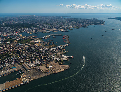 Aerial view of New York City from a helicopter on a sunny summer day.