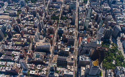 Aerial view of New York City from a helicopter on a sunny summer day.