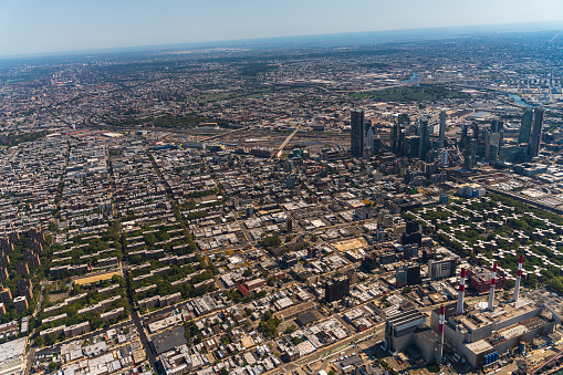 Aerial view of New York City from a helicopter on a sunny summer day.