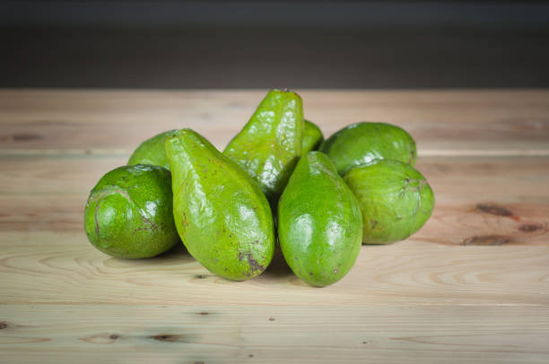 istock fresh avocado fruit on wooden table 1330127474
