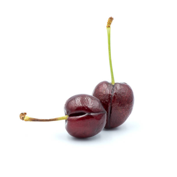 istock Reddish-purple cherries that are isolated on the white background 1330130023