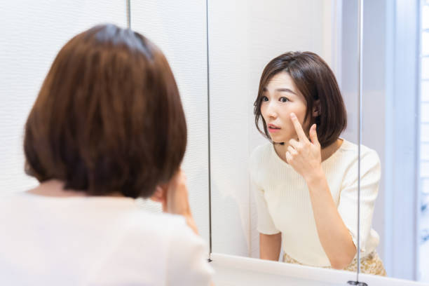 istock asian woman to see a mirror 1330130725