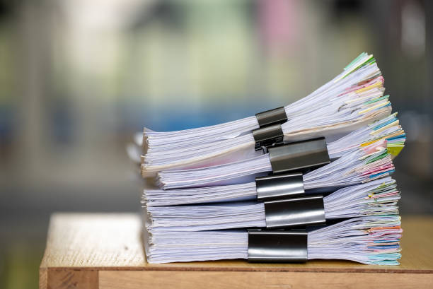 istock close up stacking of office working document Paperwork business with paper clip folder 1330130740