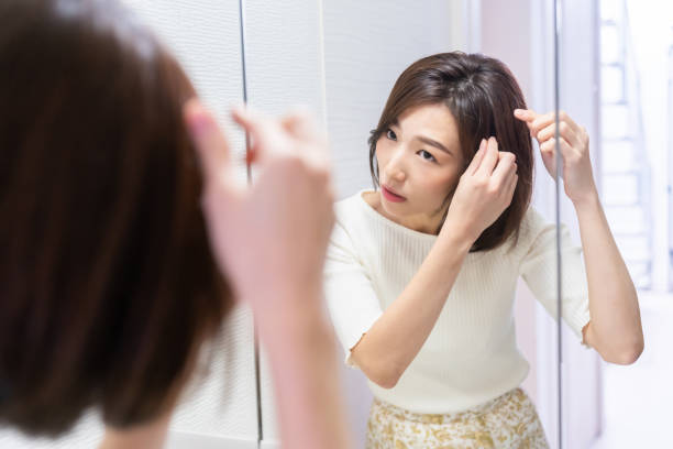 istock asian woman to see a mirror 1330130823