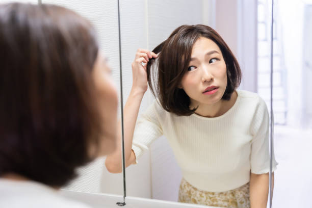 istock asian woman to see a mirror 1330130848
