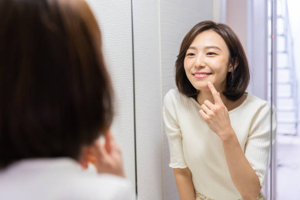 istock asian woman to see a mirror 1330130852