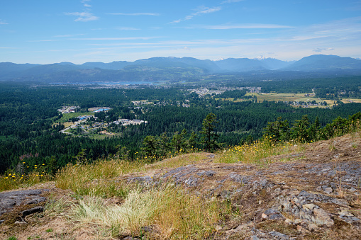 View of Port Alberni and Vancouver Island's Alberni Valley from rock outcropping at summit of Alberni Lookout.