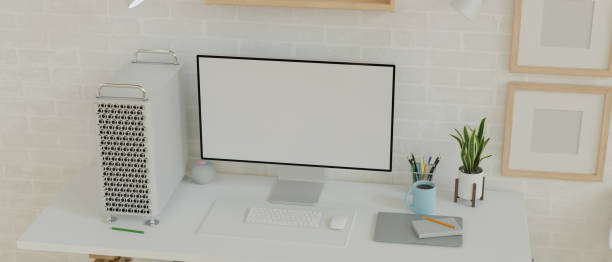 istock Desktop computer empty monitor in minimalistic modern home interior with blank frames for product display 1330140424
