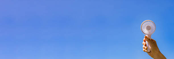 istock Portable handy fan in summer blue sky 1330143527