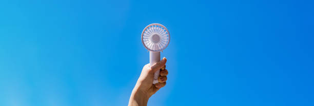 istock Portable handy fan in summer blue sky 1330143528