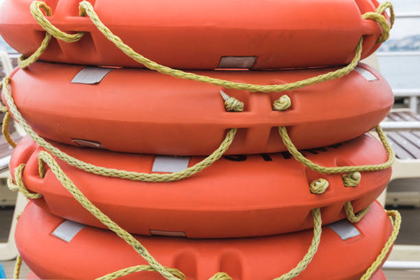 istock Stack lifebuoy orange lying on the deck of the ferry, boat, ship 1330149904