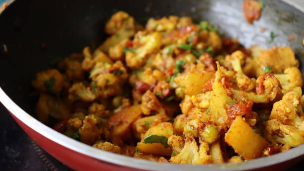 istock Aloo Gobhi an Indian Vegan recipe being cooked 1330150908