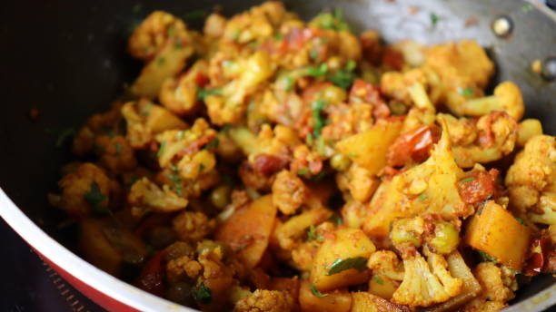 istock Aloo Gobhi an Indian Vegan recipe being cooked 1330150912