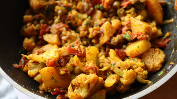 istock Aloo Gobhi an Indian Vegan recipe being cooked 1330150929