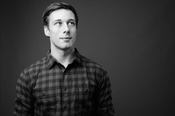 istock Young handsome hipster man in black and white 1330157349