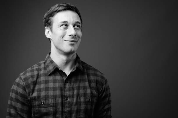 istock Young handsome hipster man in black and white 1330157360