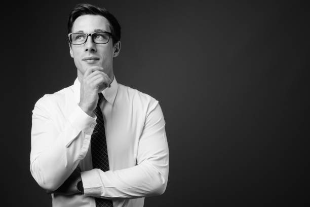 istock Young handsome businessman with eyeglasses in black and white 1330157538