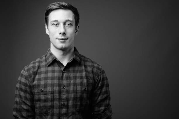 istock Young handsome hipster man in black and white 1330157558