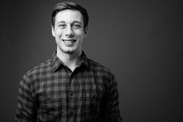 istock Young handsome hipster man in black and white 1330157575