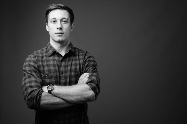 istock Young handsome hipster man in black and white 1330158219