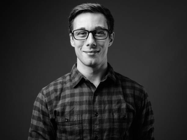 istock Young handsome hipster man in black and white 1330158225