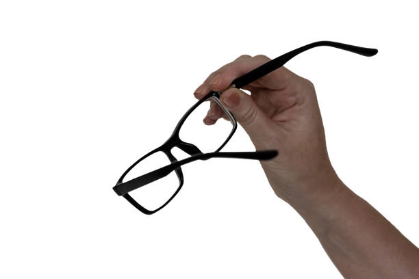 istock A woman`s hand holding a glasses, isolated 1330158578