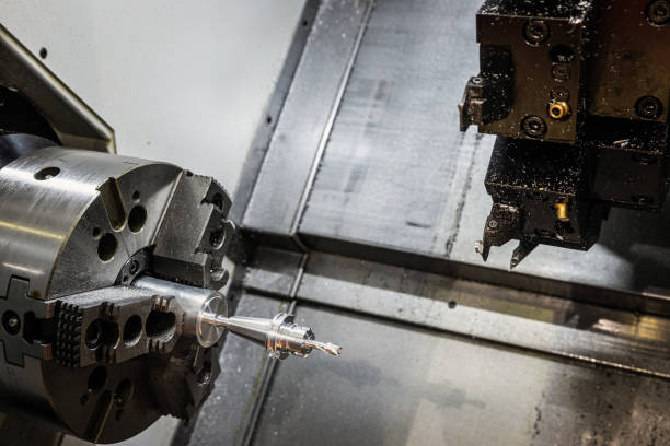istock CNC lathe machine or Turning machine drilling the steel rod 1330160565