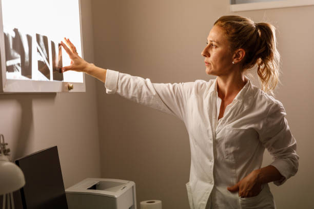istock Arranging scans on x-ray lightbox and reviewing them 1330161303