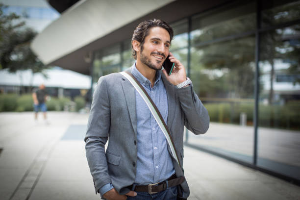 istock Cheerful entrepreneur talking on a mobile phone 1330165564