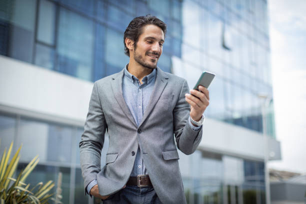 istock Cheerful entrepreneur talking on a mobile phone 1330165637